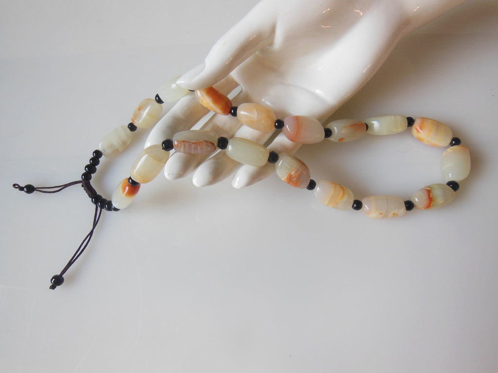 Jade beaded necklace from China.  Black and cream with shades of bronze.-2